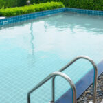 Hotel swimming pool with sunny reflections